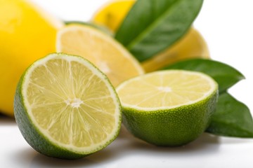 Lemons and Limes with Leaves Close-Up