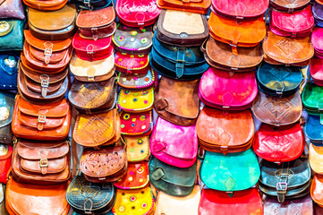Colorful handicrafted handbags in the souk of Marrakech - Morocco