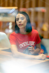 Portrait of brunette Portrait of brunette girl with overlook tshirt in red