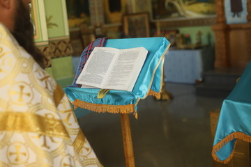 The priest reads a prayer