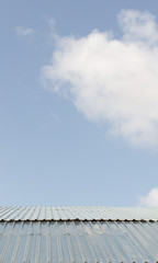 Beautiful blue cloud over the roof of the house