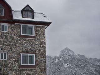 A large stone house in snow mountain landscape. South Korea