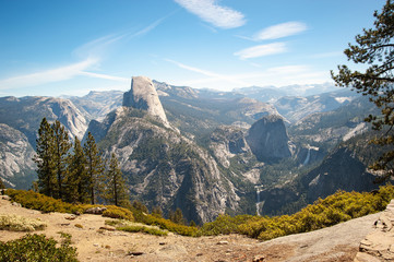A wide shot of some of the features in Yosemite, including Half Dome.  California, June 2018