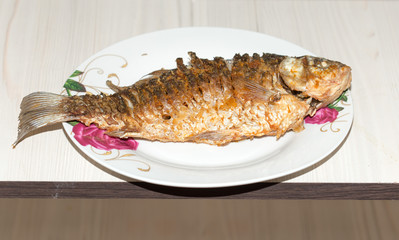 Fried fish in the plate