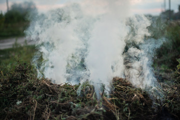 Smoke of a fading fire on the street. For use as a texture