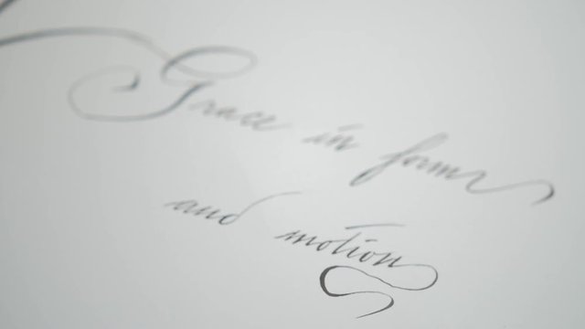 Pull focus on a quote wrote in calligrapher.