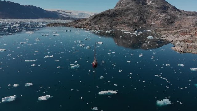 View of Sailboat and Icebergs in Johan Petersen Fjord East Greenland