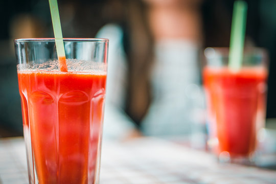 glass with tomato juice and a straw
