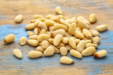 pine nuts pile on wood