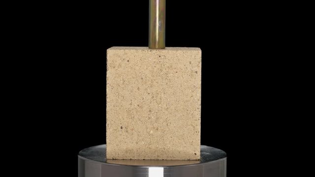 building bricks tested and tested for strength hydraulic press, close-up