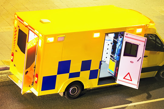 ambulance car sick in street city  at night