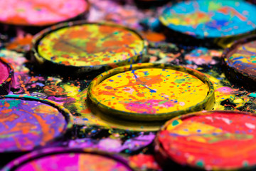 Watercolor paint palette. Colorful paint splash.