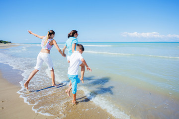 Happy family having fun in the summer leisure