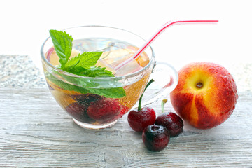 beverage from berries in a glass, transparent glass, fruit berries measuring tape, proper nutrition, diet