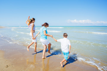 Happy family having fun in the summer leisure