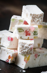 Sweet zephyr with marmalade, dark table, selective focus