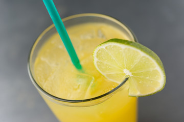 Margarita over ice with lime slice and green straw