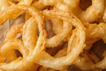 Homemade delicious golden breaded and deep fried crispy onion rings, closeup