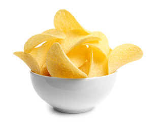 Bowl of tasty crispy potato chips on white background