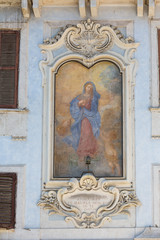 Fototapeta na wymiar Painting of the Madonna in a piazza in Rome, Italy