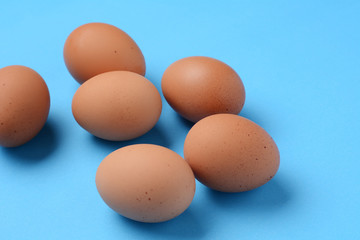Top view of six brown eggs