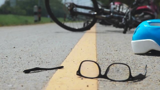 Accident motorcycle crash with bicycle on road
