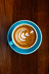 cup of coffee on wooden table