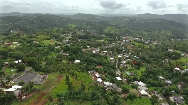 Flying drone above the houses and trees in Community The "Corujas"