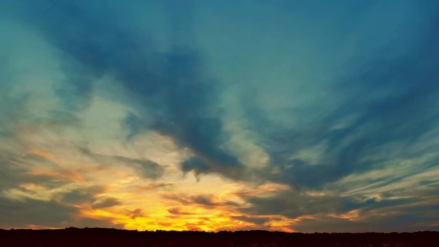 Clouds dramatic billowing clouds at sunset sky at sunset.