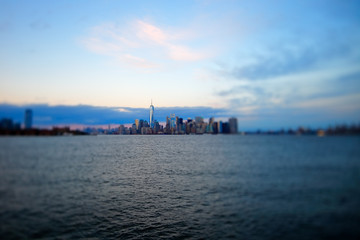 Fototapeta na wymiar Manhattan in New York City viewed from the Hudson River trough a tilt shif lens