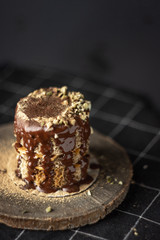 Chocolate mini cake with crush nuts and peanut butter.  