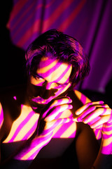 Cinematic portrait of man in yellow and purple lines, projecto