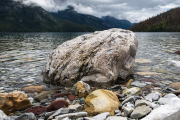 Unique rock on a peaceful lake in the Canadian wilderness