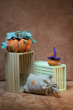 Still life with handmade pumpkins from felted wool for the celebration of Halloween