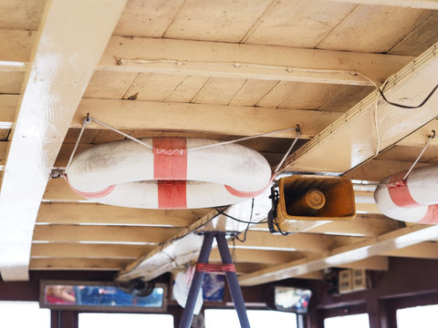  lifebuoy hanging on wood ceiling of passenger ship