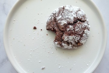 Chocolate cookies on white plate.