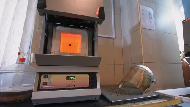 Industrial clinker Lab Testing. Muffle furnace in chemistry lab. Push in, Muffle furnace in laboratory for cement testing. 4K footage