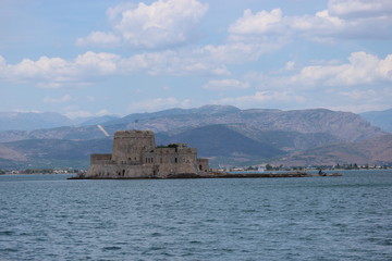 Fototapeta na wymiar Old venetian fortress Bourtzi and surrounding landscape, Nafplio, Peloponnese, Greece