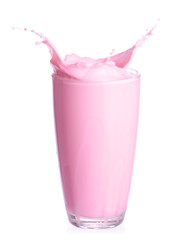 Strawberry milk splash out of glass isolated on white background.