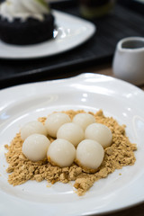 soft rice cake balls in soy powder and sugar syrup