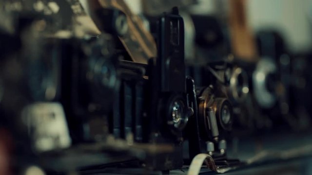 Variety of Old Vintage cameras are kept in a showcase of a Pawn Shop or Repair shop