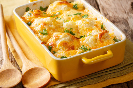 Vegetable casserole from cauliflower with cheese, eggs and cream close-up in a baking dish. horizontal