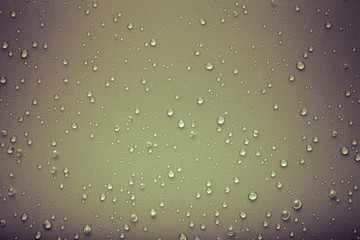 Drops of water on a color background. Gray. Toned