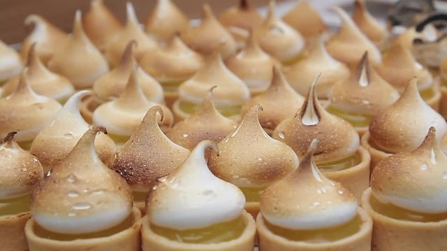 Small Key Lime pies in rows rack focus
