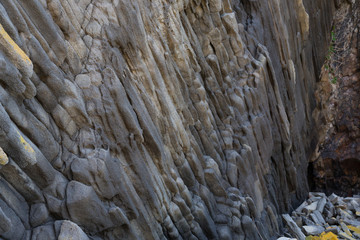 Cape Stolbchaty. Cape on the west coast of the island of Kunashir. It is composed of layers of basaltic lavas of the Mendeleyev volcano.