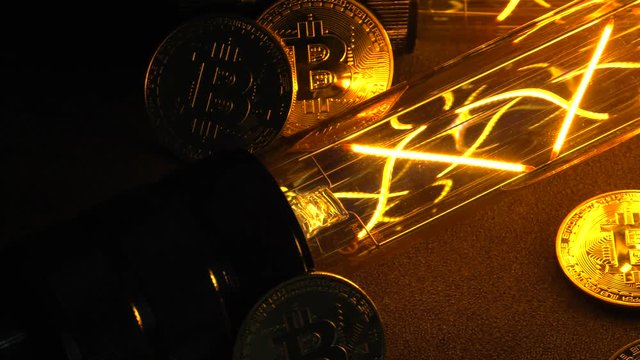 BTC among avid bulbs. The light flashes, an electrical short circuit. 4K, UHD, 50p, Cinematic,Closeup, Shallow depth of fields.