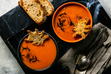 Halloween style pumpkin soup - with spider shaped toast, top view