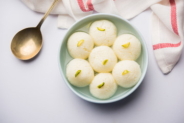 Indian Rasgulla or Rosogulla dessert/sweet served in a bowl. selective focus
