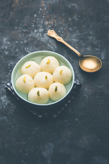 Indian Rasgulla or Rosogulla dessert/sweet served in a bowl. selective focus