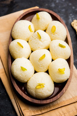 Indian Rasgulla or Rosogulla dessert/sweet served in a bowl. selective focus